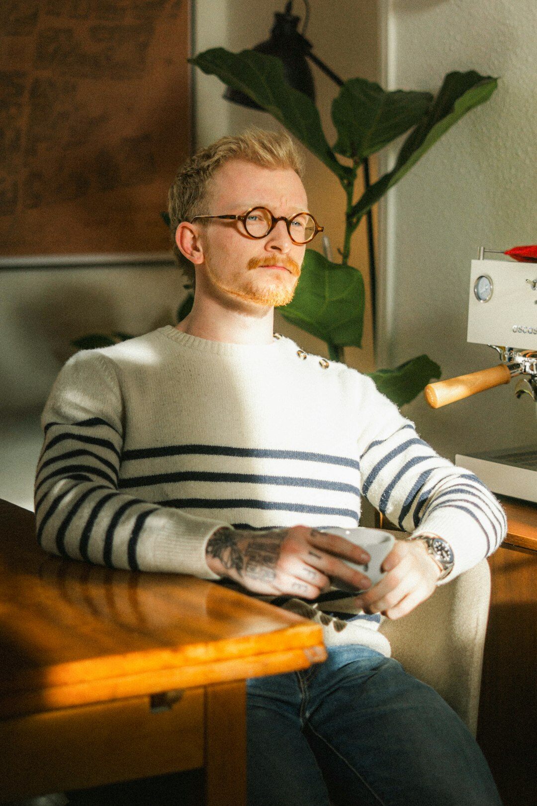 Dutch male editor with glasses writing at his desk