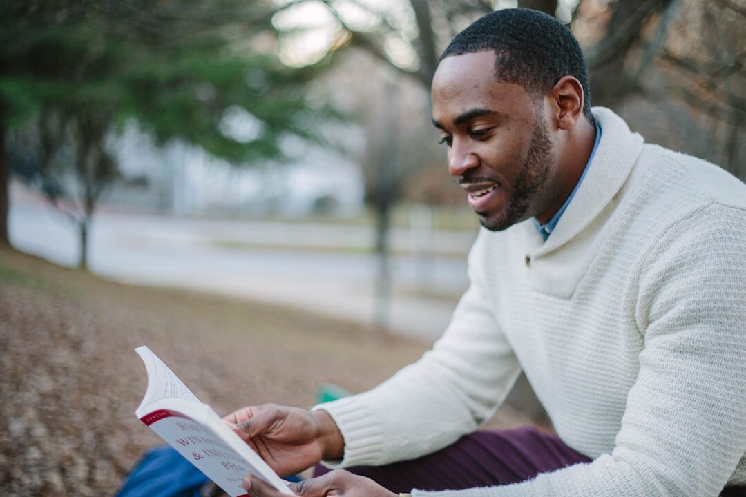 man reading crime novel