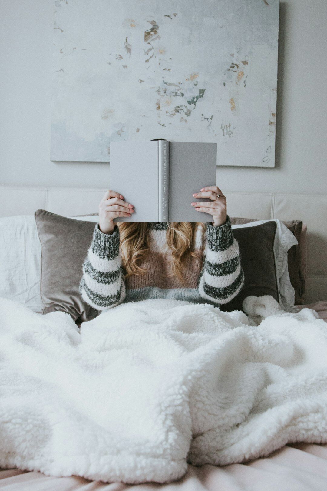 person relaxing with book